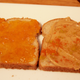 Halves of a peanut butter and jelly sandwich